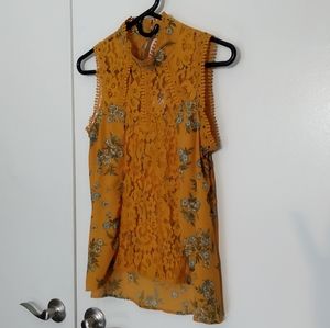 Lacey mock neck sleeveless blouse